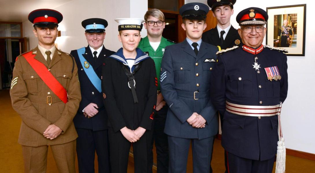 The Lord-Lieutenant with his six 2024 cadets, wearing uniforms to represent the army, air force, navy, St John's ambulance, police, and fire service.