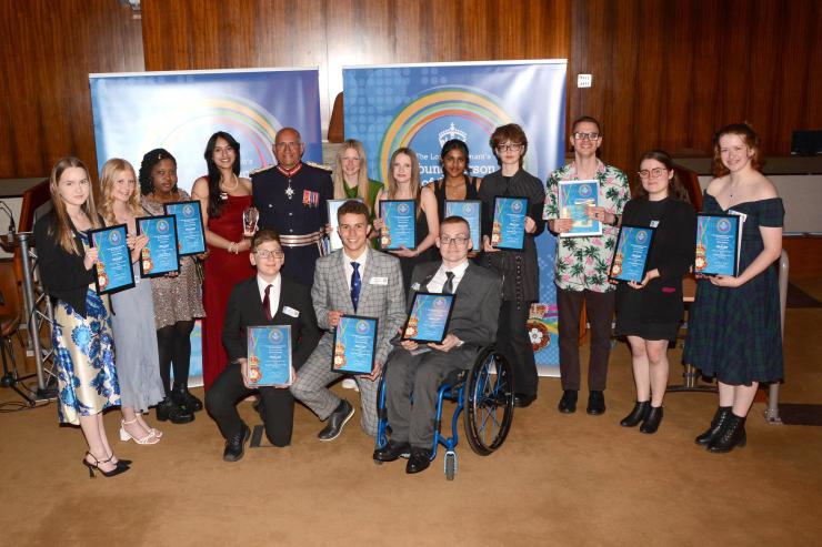 The finalists of the Lord-Lieutenant's Awards holding their certificates, standing with the Lord-Lieutenant